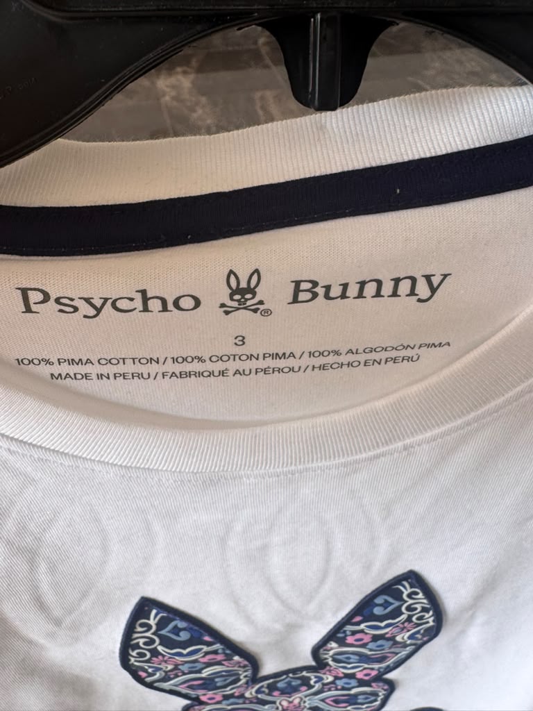 Camiseta Psycho Bunny Original Blanca con Logo Floral Morado – Talla M | Bunnyshop305